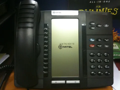 Mitel office desk phone with handset